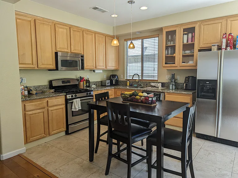 Kitchen with granite, dishwasher, water filtration system under the sink.