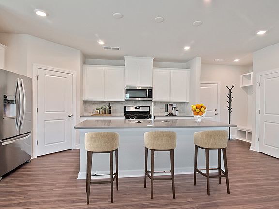 The stunning kitchen island overlooks the open-concept living space.