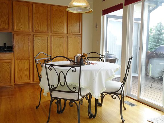 Notice The Cabinet Space In Casual Dining Area & Patio Door To Deck In Back