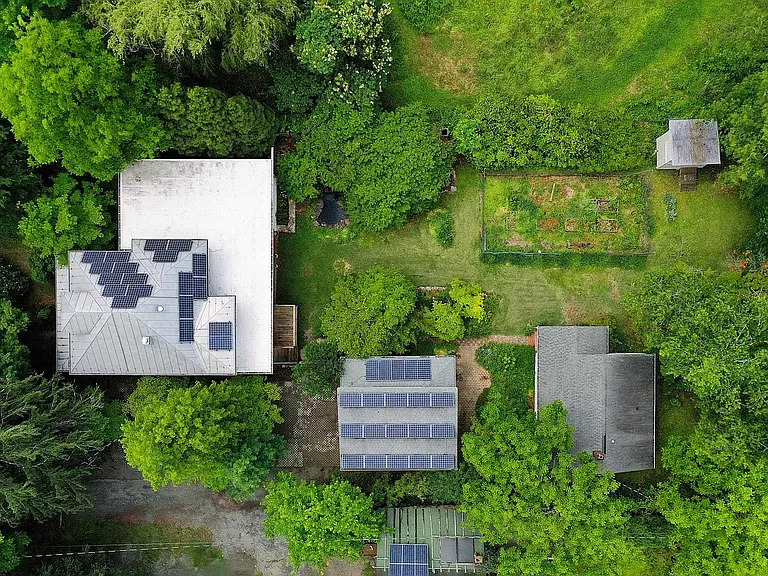 Main house, garage, and cottage (cottage does not have solar panels)