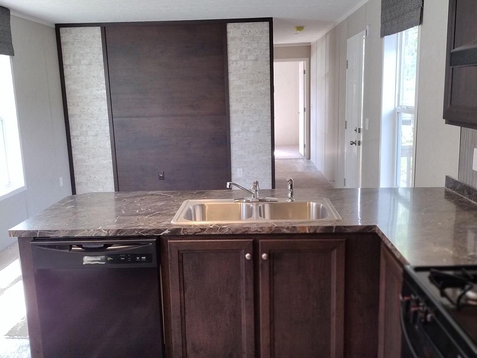 Open floor plan, looking from Kitchen into living room.