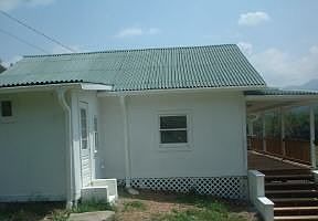 Side view of house showing new roof