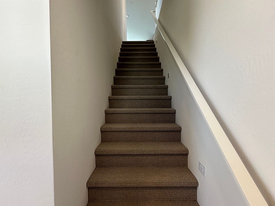 Stairs from 2 car garage and front door