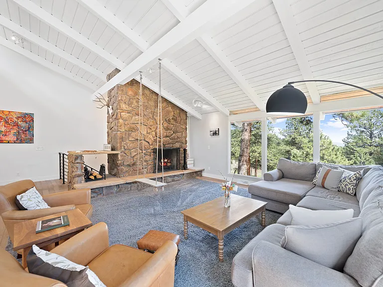 Family room includes wood burning fireplace.