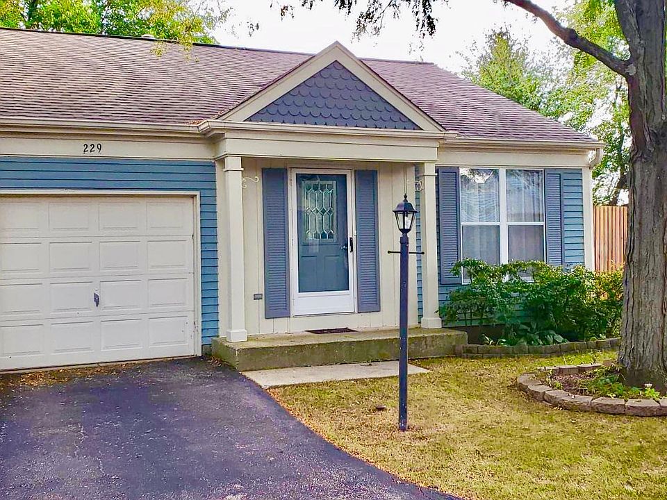 1 story ranch, attached 1 car garage. Street parking + shared parking spaces to right of home.