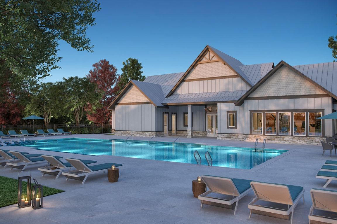 Resort-style pool with spacious sundeck and lounge seating. This image is a representation of the pool with sundeck at Amavi Brier Creek and is tentatively scheduled to open Summer 2025.