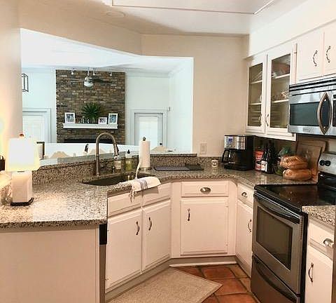 Kitchen with granite and stainless steel appliances