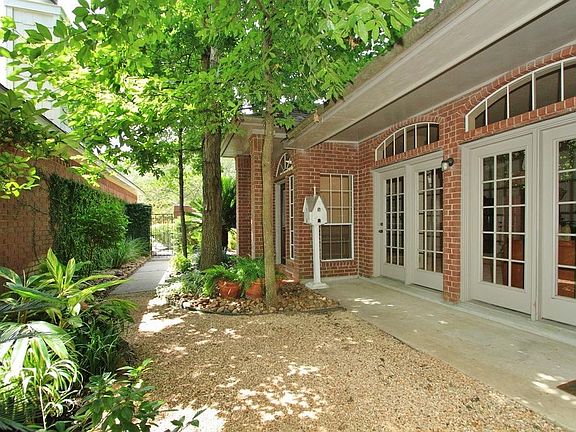 A door off the Living Room and one off the Breakfast Room provide access to the Covered Patio.