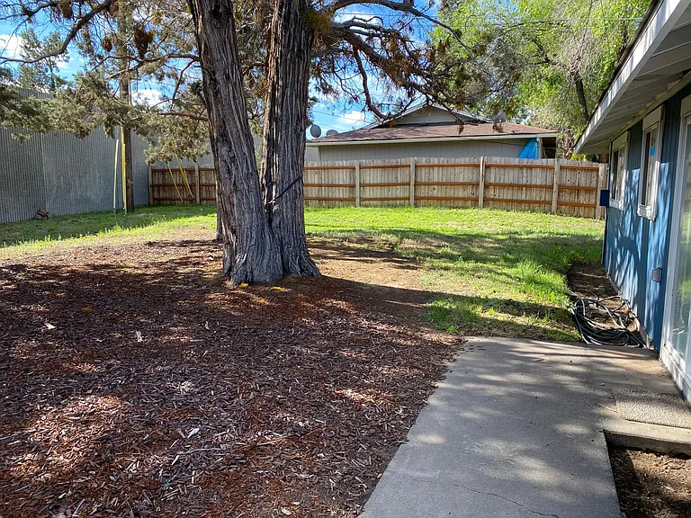 Alternate view of large, fully fenced backyard