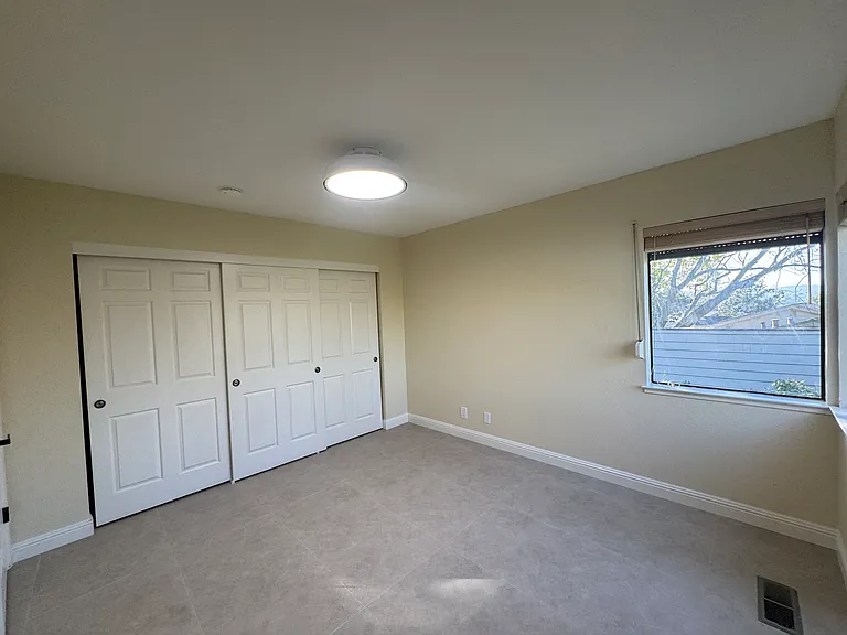 Back secondary room with large closet space