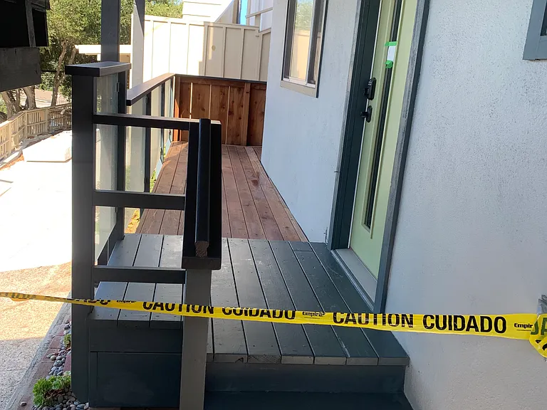 Balcony with front door of Unit B (caution tape now removed)