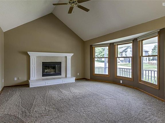 Living room with newer carpet and fresh paint.