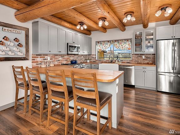 Fabulous new kitchen includes butcher block countertops, stainless appliances, new light fixtures and all new flooring and cabinetry.