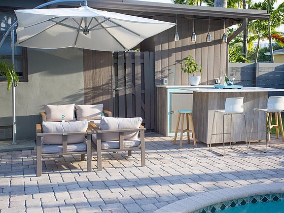 Several outdoor seating and dining areas including bar and grill