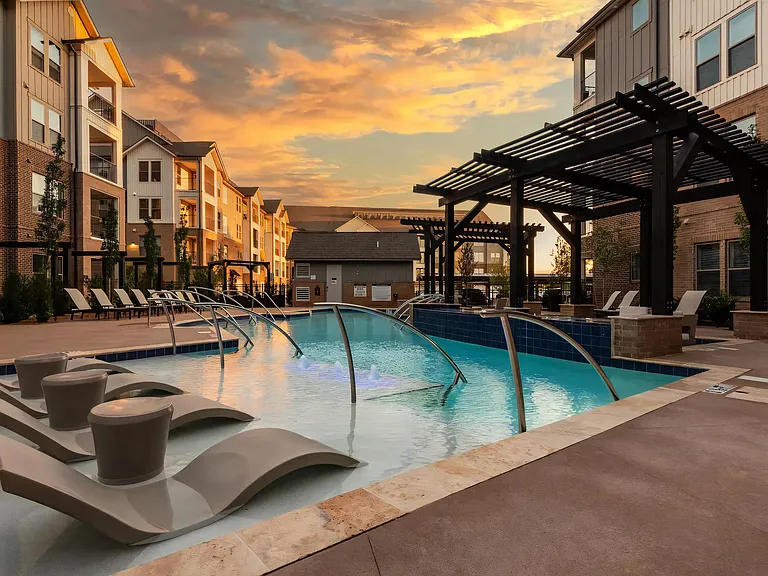 Sunset Views Over Resort-Style Pool with In-Water Seating