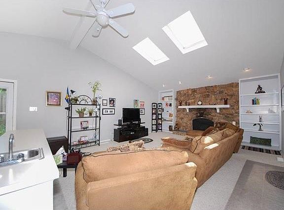 View of great room built-in bookcases and wet bar.