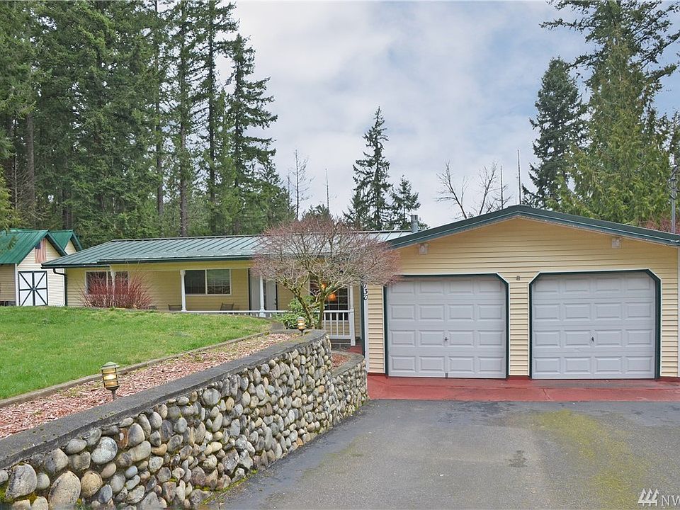 Front of house showing 2 car garage.