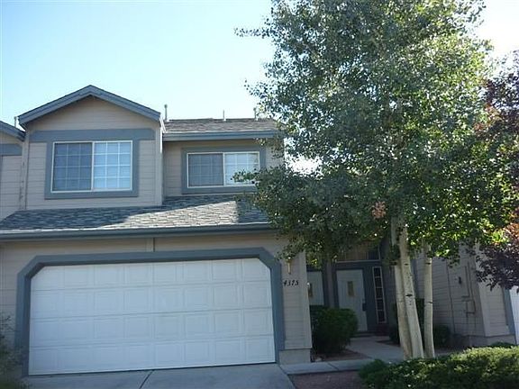 Attached 2-car garage and Aspen trees