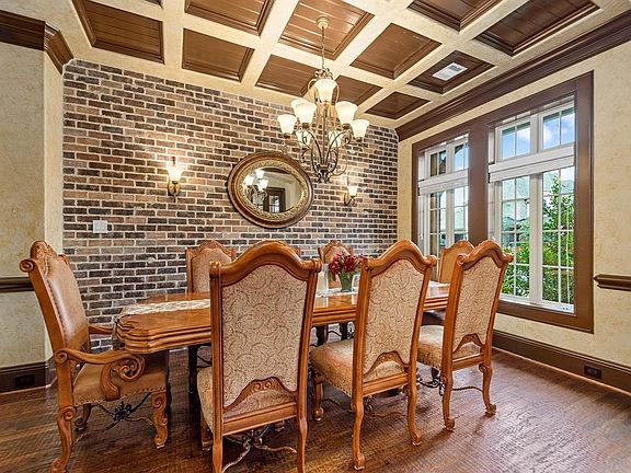 As soon as you enter the home, you are great by this warm and welcoming formal dining room.