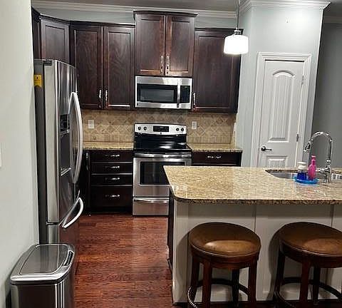 Kitchen with SS appliances and granite countertops
