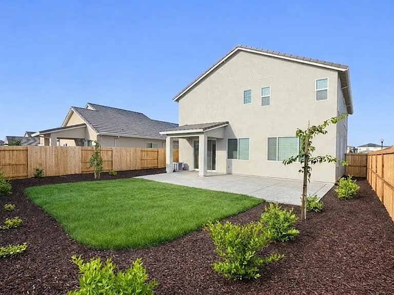 Spacious backyard with nice landscaping. Gardening services included!