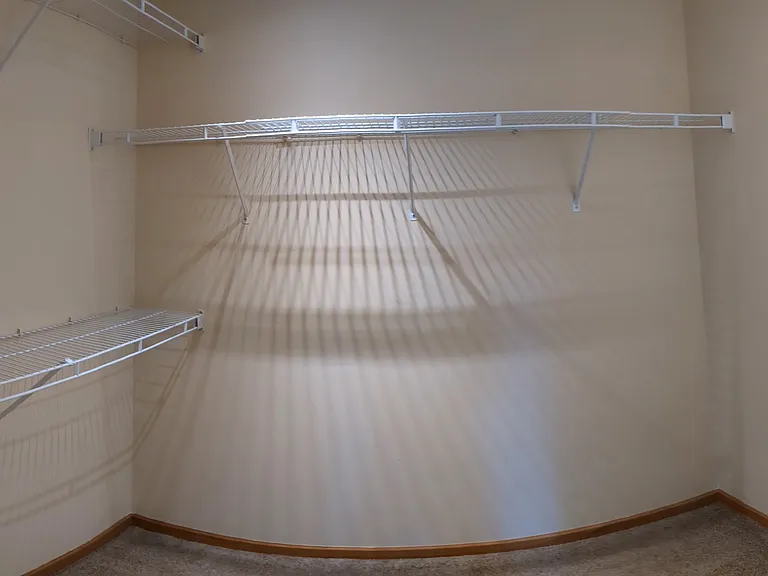 The walk-in closet in the master bedroom