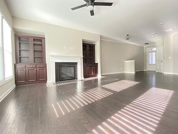 living room with a brand new ceiling fan. dimmable light.