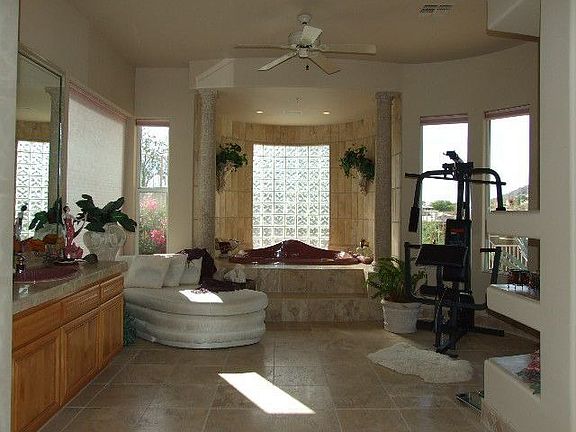 Fabulous Master Bath with spa tub and exercise area looking out to mountains 