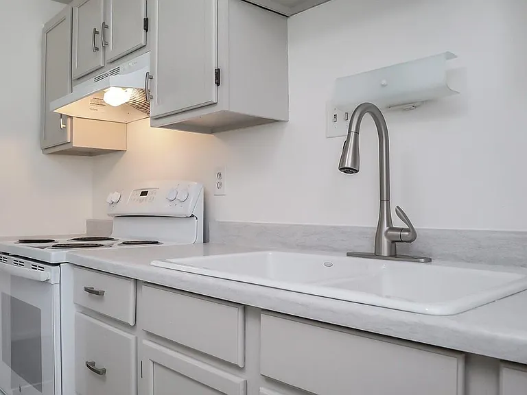 Almot New Clean Kitchen Counter with Newer Sink and Faucet. New Refrigerator