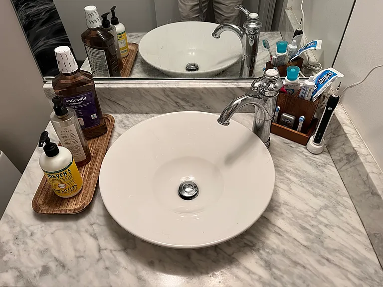 Marble countertop with raised sink for more useable surface area.