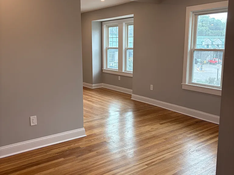 Dining Room - Refinished hardwood floors, new windows, new insulation, new sheetrock, and new electrical.