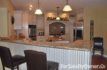 Kitchen
						:
						Glazed cabinetry with granite counter tops and backsplash!