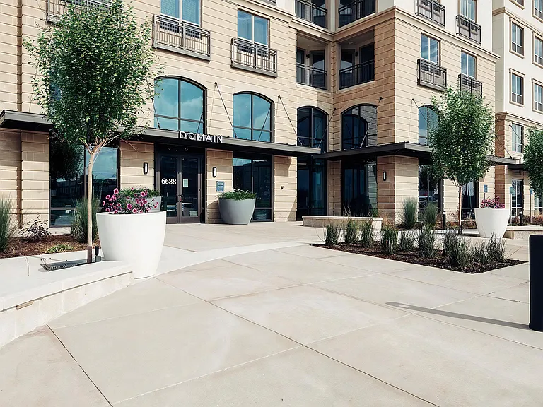 Entrance to Domain at The Gate with Grand Arched Windows and Landscaped Walkway