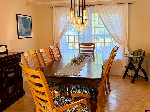 Large dining table is great to host large groups with an extra leaf to seat 10. Also includes a high chair.