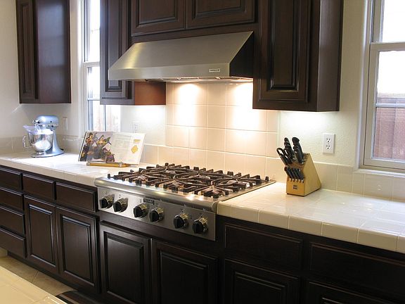 Open floor plan to large adjoining living room w/ huge chef's kitchen and Thermador Stainless Steel appliances