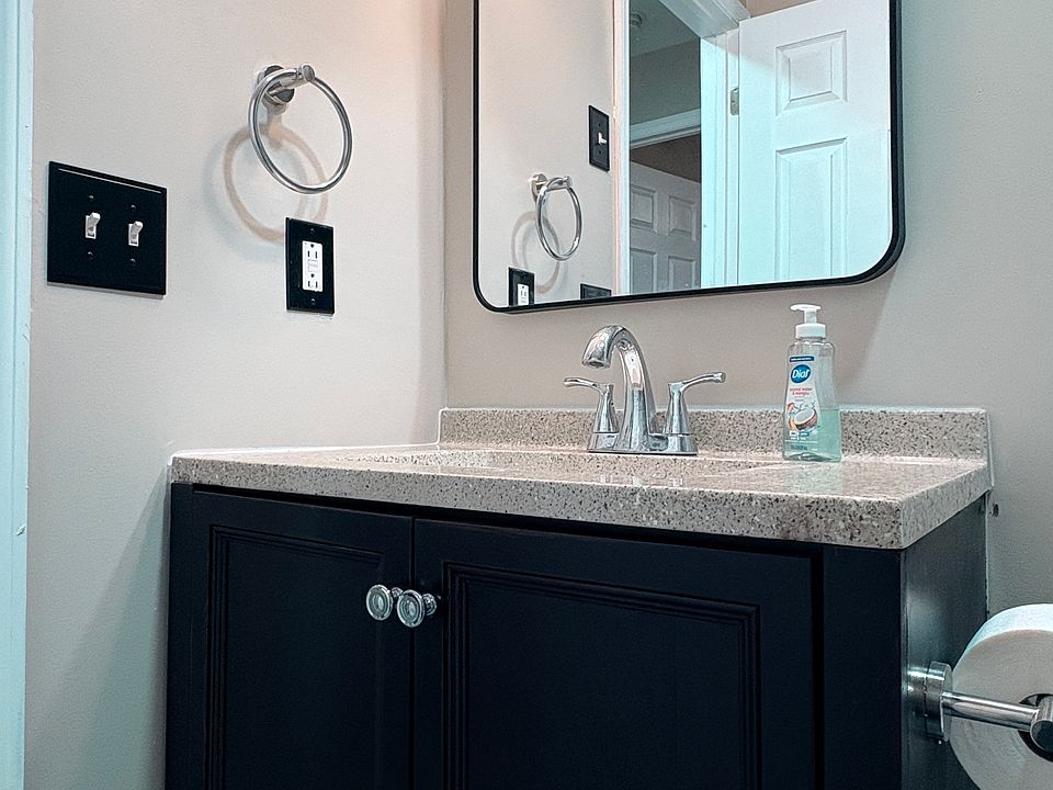 Bathroom fresh rehab, large mirror, attractive tile.