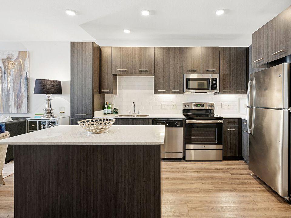 Stainless steel appliances and tiled kitchens