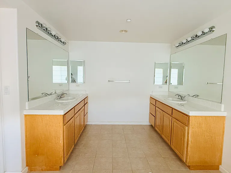 Primary bathroom with dual vanities