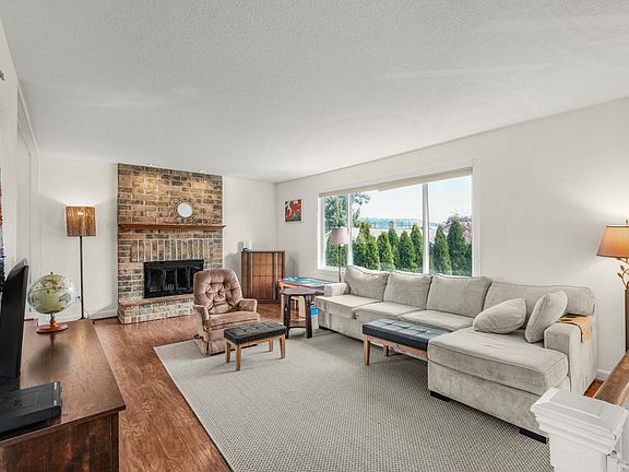 The split entry leads upwards to a large living room with beautiful views from the large front window.