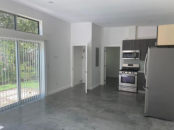 Kitchen view with stainless appliances and w/d closet (w/d included but not shown)