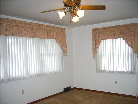 Another view of the living room, sheers that are attached to the blinds!