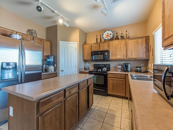 Kitchen includes black appliancces