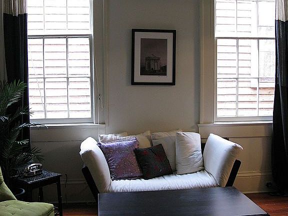 Living room with 2 large windows that allow lots of natural sunlight