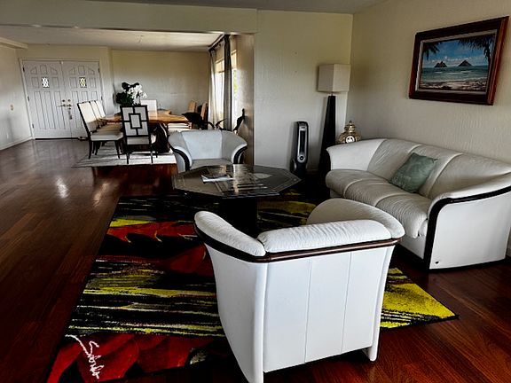 luxurious living and dining area with custom-made monkey pod dining table (sits 10 ppl)
