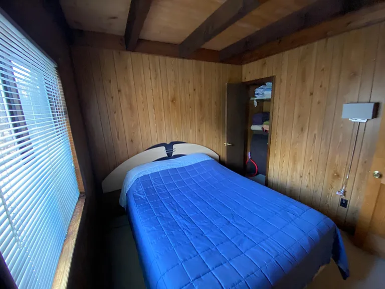 down stairs bedroom with queen size bed