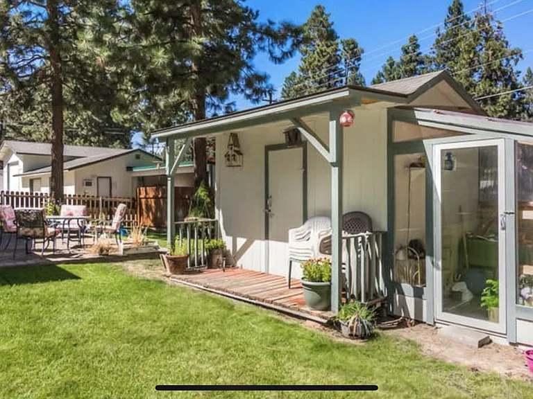 additional side patio, storage shed, and green house area