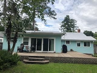 Sliding glass doors from family room open to spacious deck