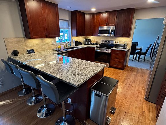 Kitchen with granite counter top.