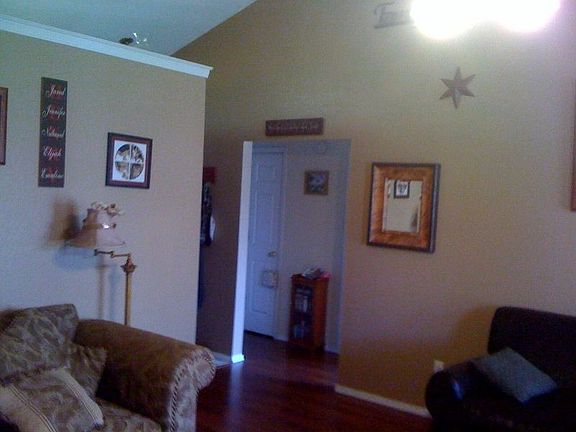 Entrance splits to rooms and into living roomw/valted cieling