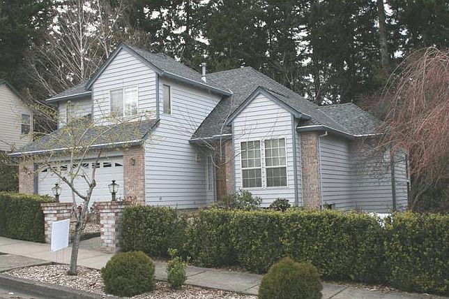 Curb appeal with greenspace in background.